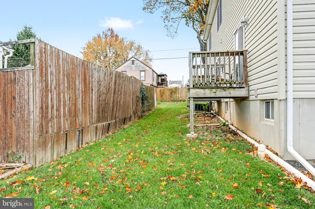 a balcony with wooden floor and fence