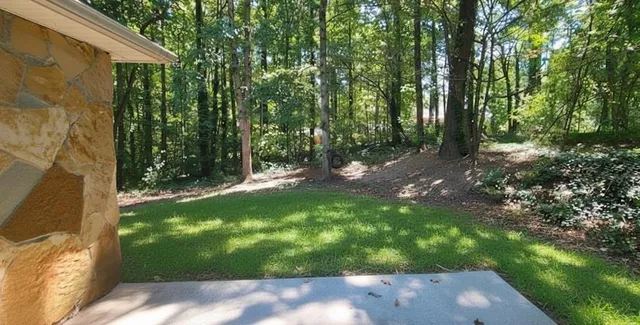 a backyard of a house with lots of green space