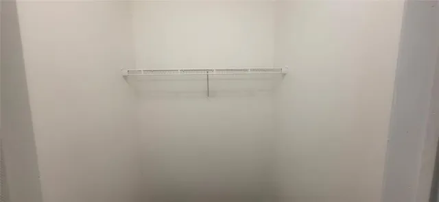 a view of a room with racks on the wall