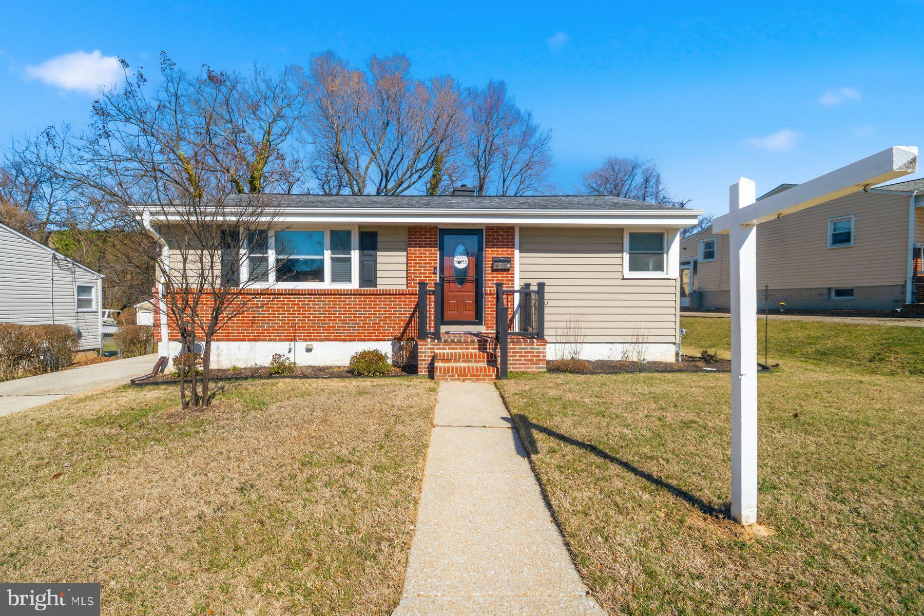 206 Cheddington Road Linthicum Heights, MD 21090 - Photo 1 of 27 a front view of a house with garden