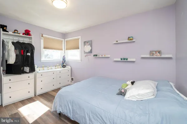 a bedroom with a bed and a closet