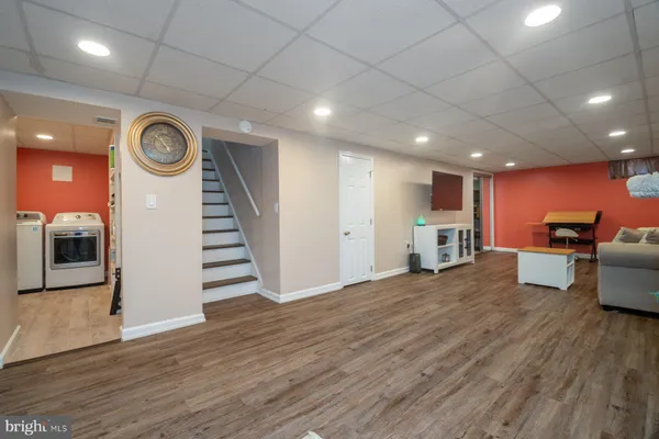 a view of kitchen with furniture and wooden floor