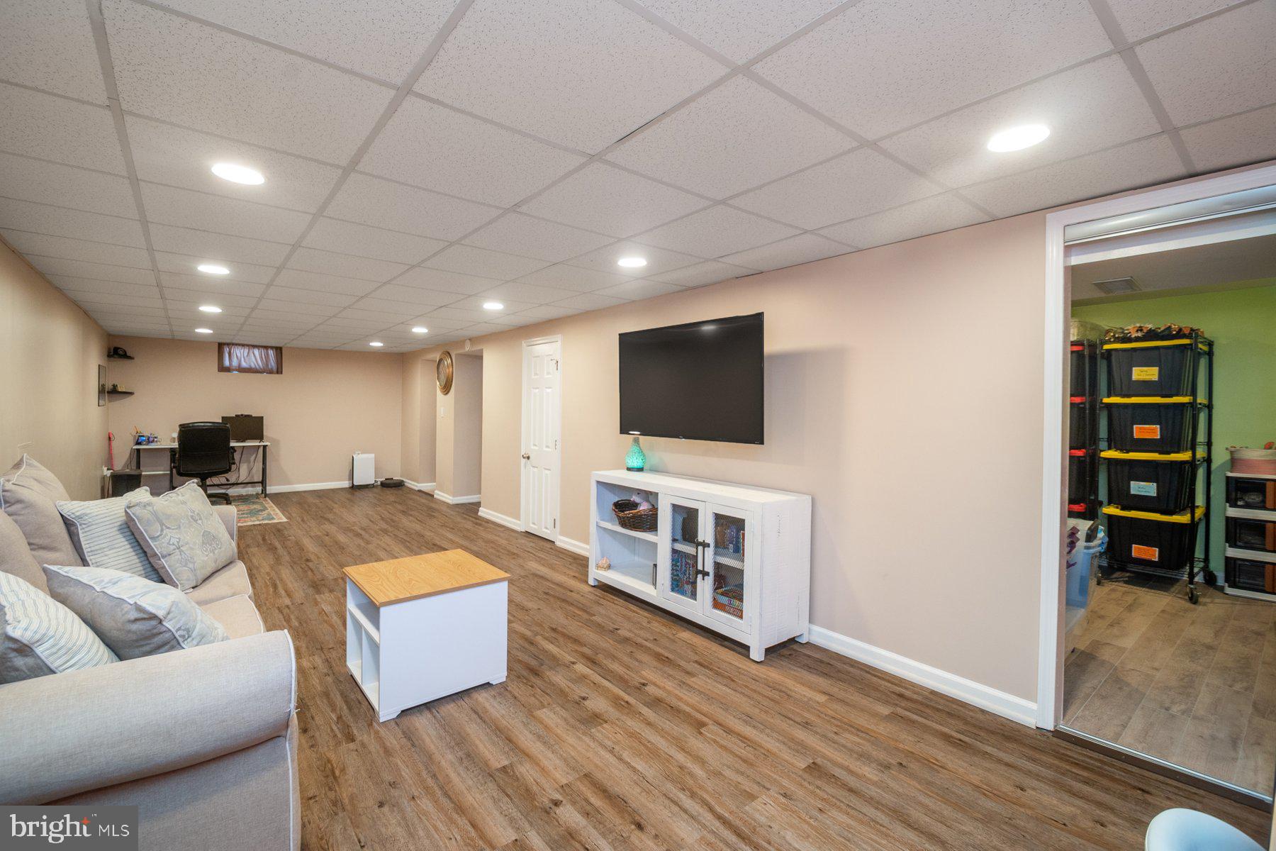206 Cheddington Road Linthicum Heights, MD 21090 - Photo 19 of 27 a living room with furniture and a flat screen tv