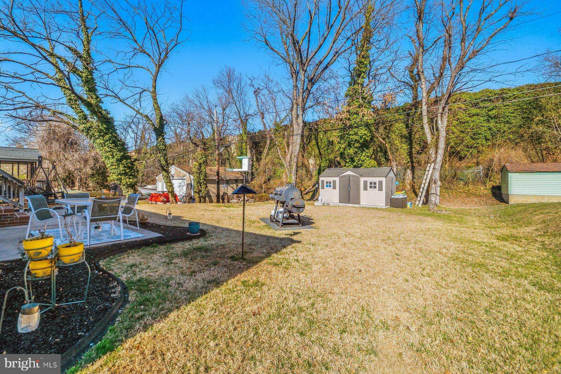 206 Cheddington Road Linthicum Heights, MD 21090 - Photo 21 of 27 a house with trees in front of it
