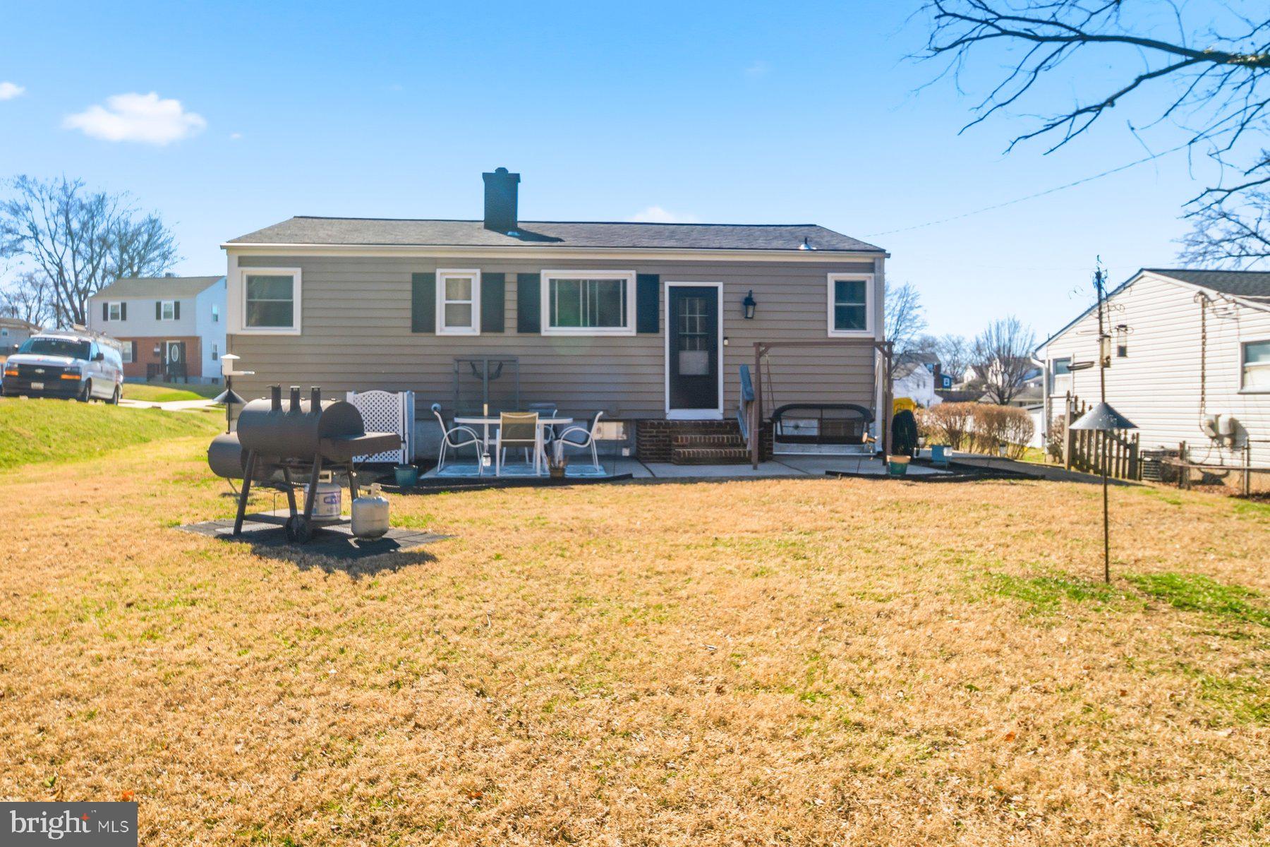 206 Cheddington Road Linthicum Heights, MD 21090 - Photo 26 of 27 a swimming pool with outdoor seating and yard