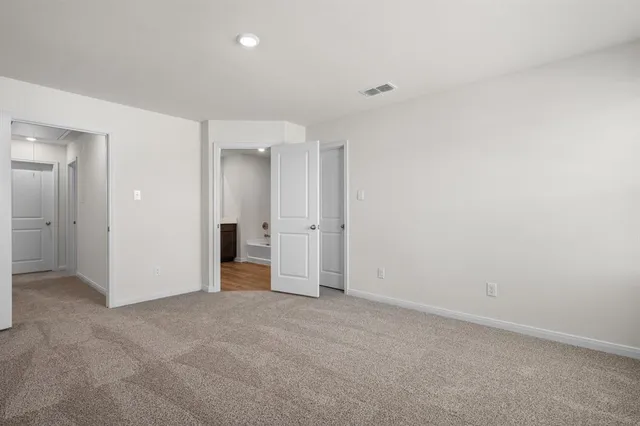 an empty room with closet area