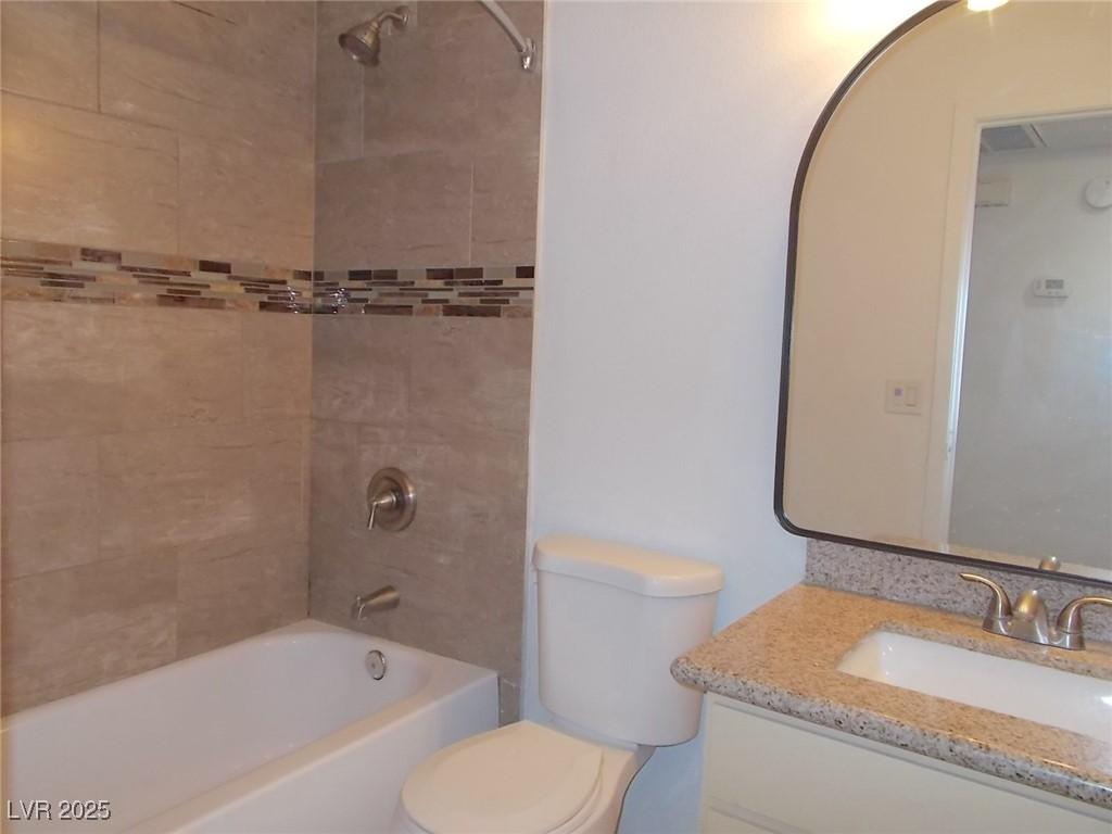 4521 Halbert Avenue Las Vegas, NV 89110 - Photo 11 of 16 Full bath with vanity, bathtub / shower combinatio