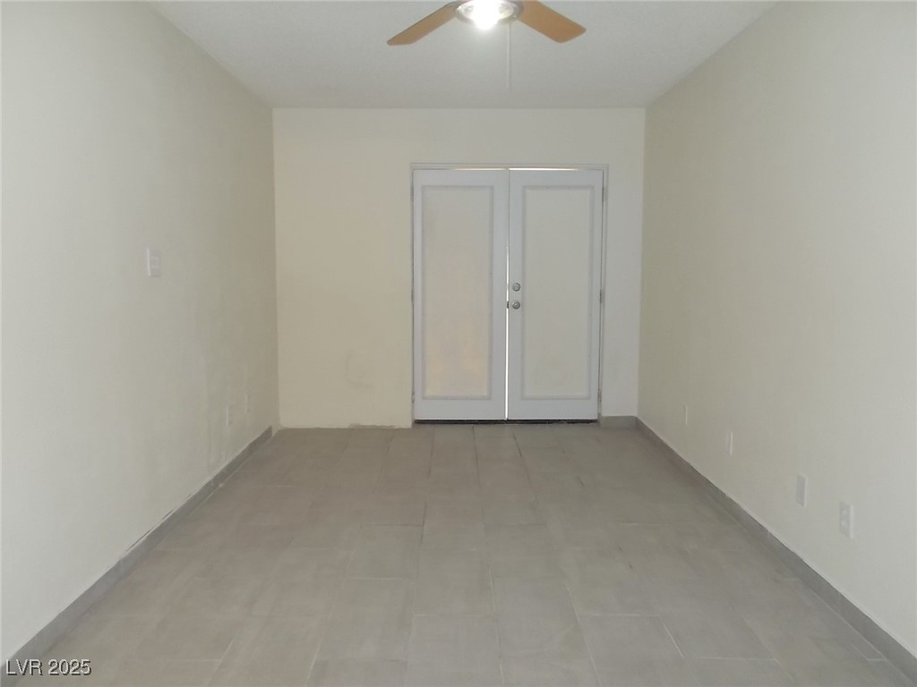 4521 Halbert Avenue Las Vegas, NV 89110 - Photo 12 of 16 Spare room featuring french doors and a ceiling fa