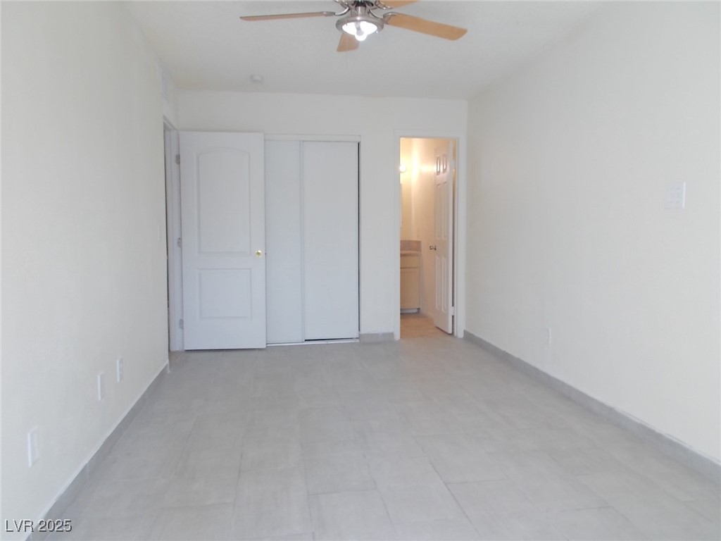 4521 Halbert Avenue Las Vegas, NV 89110 - Photo 13 of 16 Unfurnished bedroom featuring a closet, ensuite ba