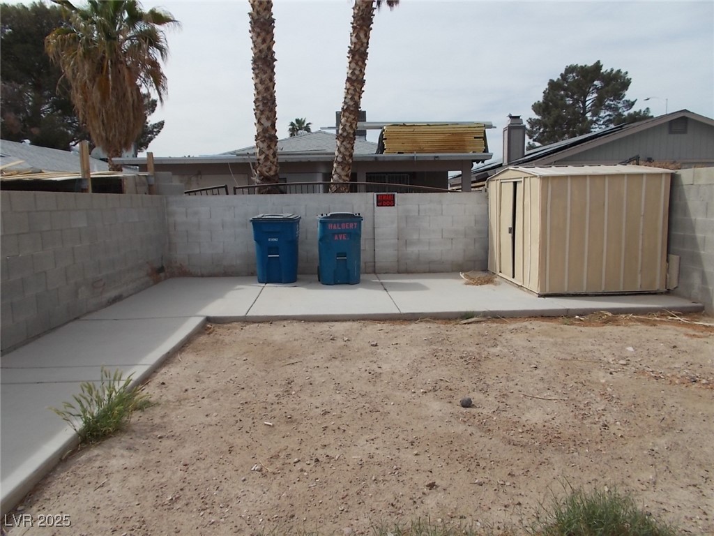 4521 Halbert Avenue Las Vegas, NV 89110 - Photo 16 of 16 View of yard featuring a patio, an outbuilding, a