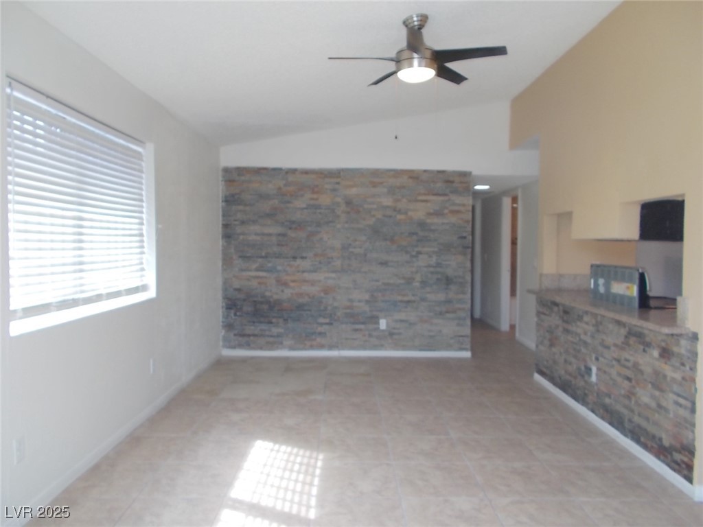 4521 Halbert Avenue Las Vegas, NV 89110 - Photo 3 of 16 Living area with light tile patterned floors, base