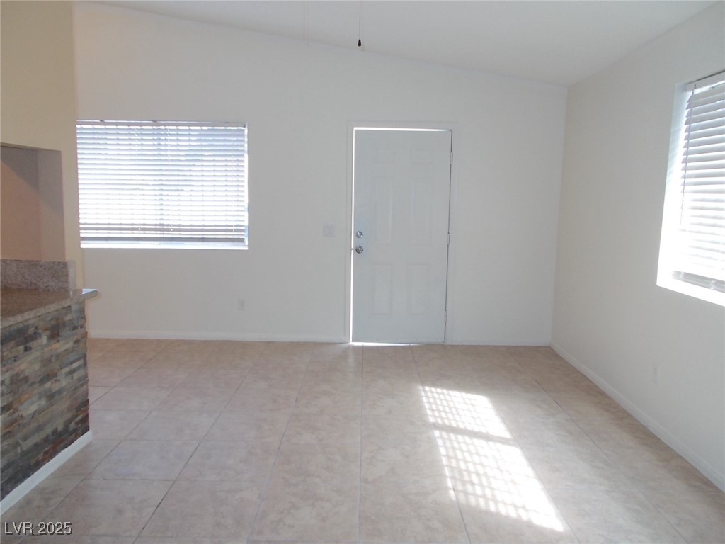 4521 Halbert Avenue Las Vegas, NV 89110 - Photo 4 of 16 Spare room featuring light tile patterned floors,