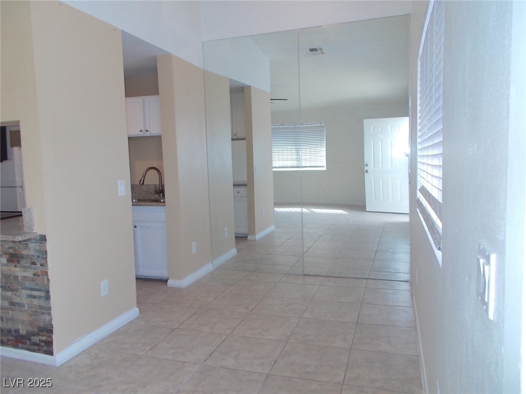 4521 Halbert Avenue Las Vegas, NV 89110 - Photo 6 of 16 Hallway featuring a sink, visible vents, baseboard