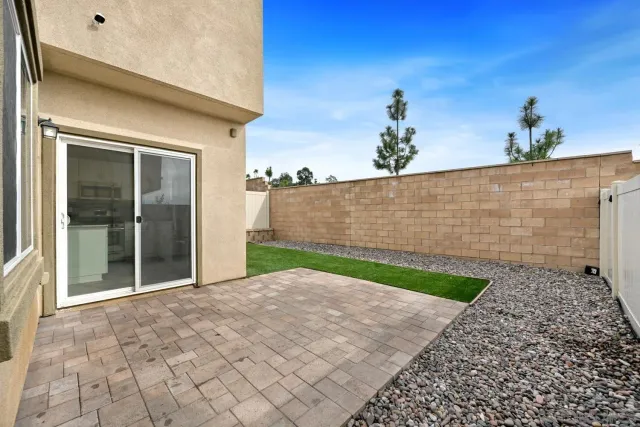 a view of backyard with potted plants