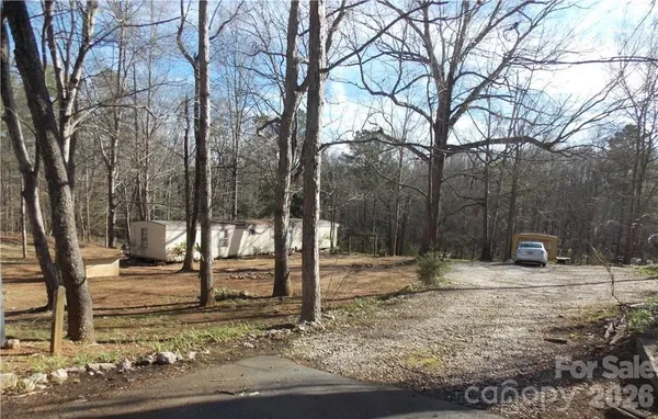 a backyard of house with trees