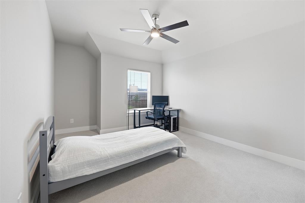 5805 Heatherwood Loop Sachse, TX 75048 - Photo 36 of 39 a bedroom with a bed and window