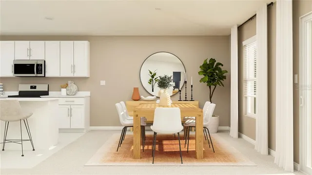 a view of a dining room with furniture and a window
