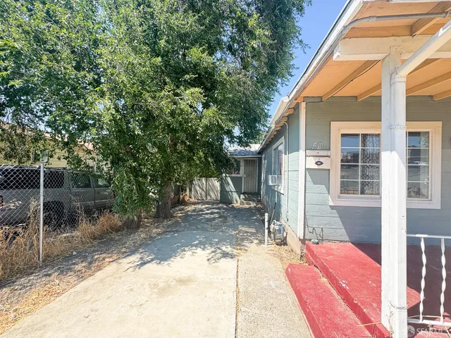 a house view with a backyard space