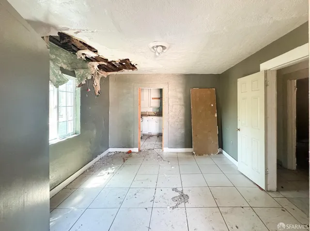 a kitchen with a refrigerator a stove a microwave and cabinets