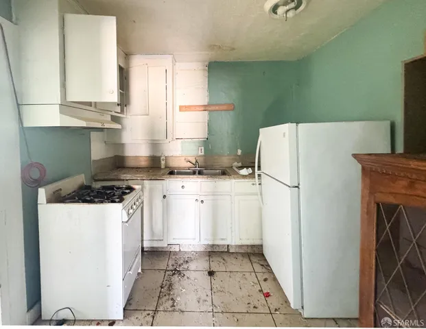 a bathroom with a granite countertop toilet sink and mirror