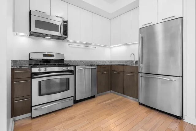 a picture of a wall with a white and white refrigerator
