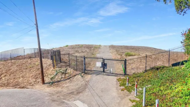 an aerial view of mountain with yard