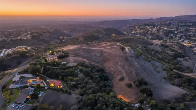 an aerial view of residential house and green space