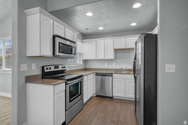 2457 West 500 South, Unit 2 Springville, UT 84663 - Photo 13 of 27 Kitchen featuring white cabinetry and stainless steel appliances