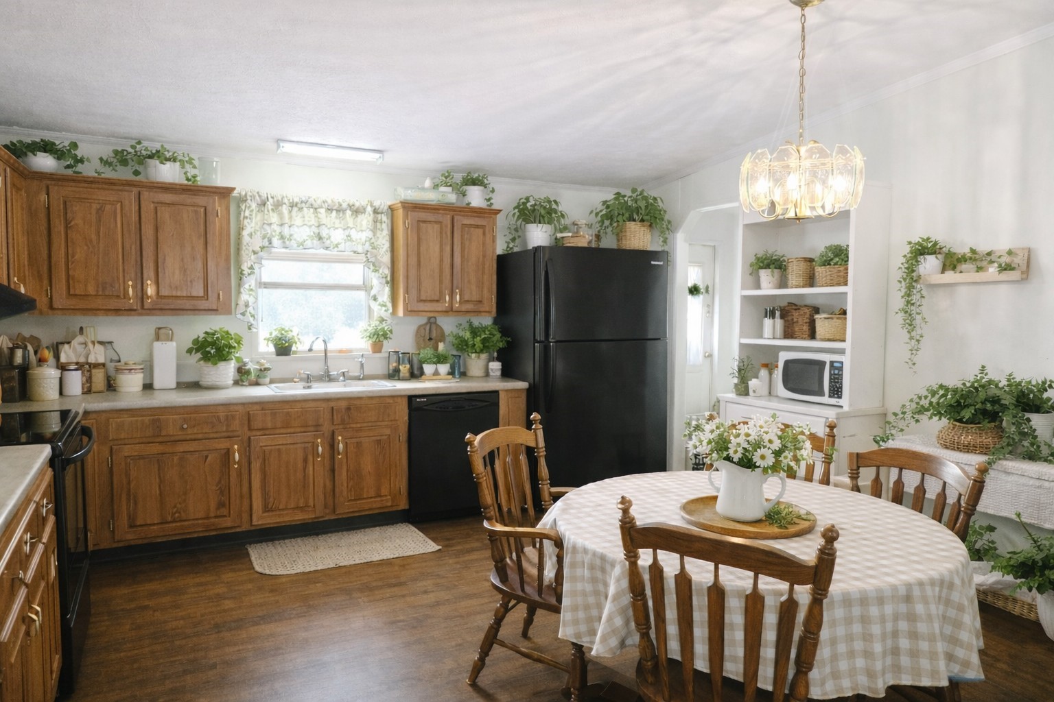 1202 County Road 1099 Wiergate, TX 75977 - Photo 12 of 22 a kitchen with stainless steel appliances granite countertop a refrigerator a sink dishwasher a dining table and chairs with wooden floor