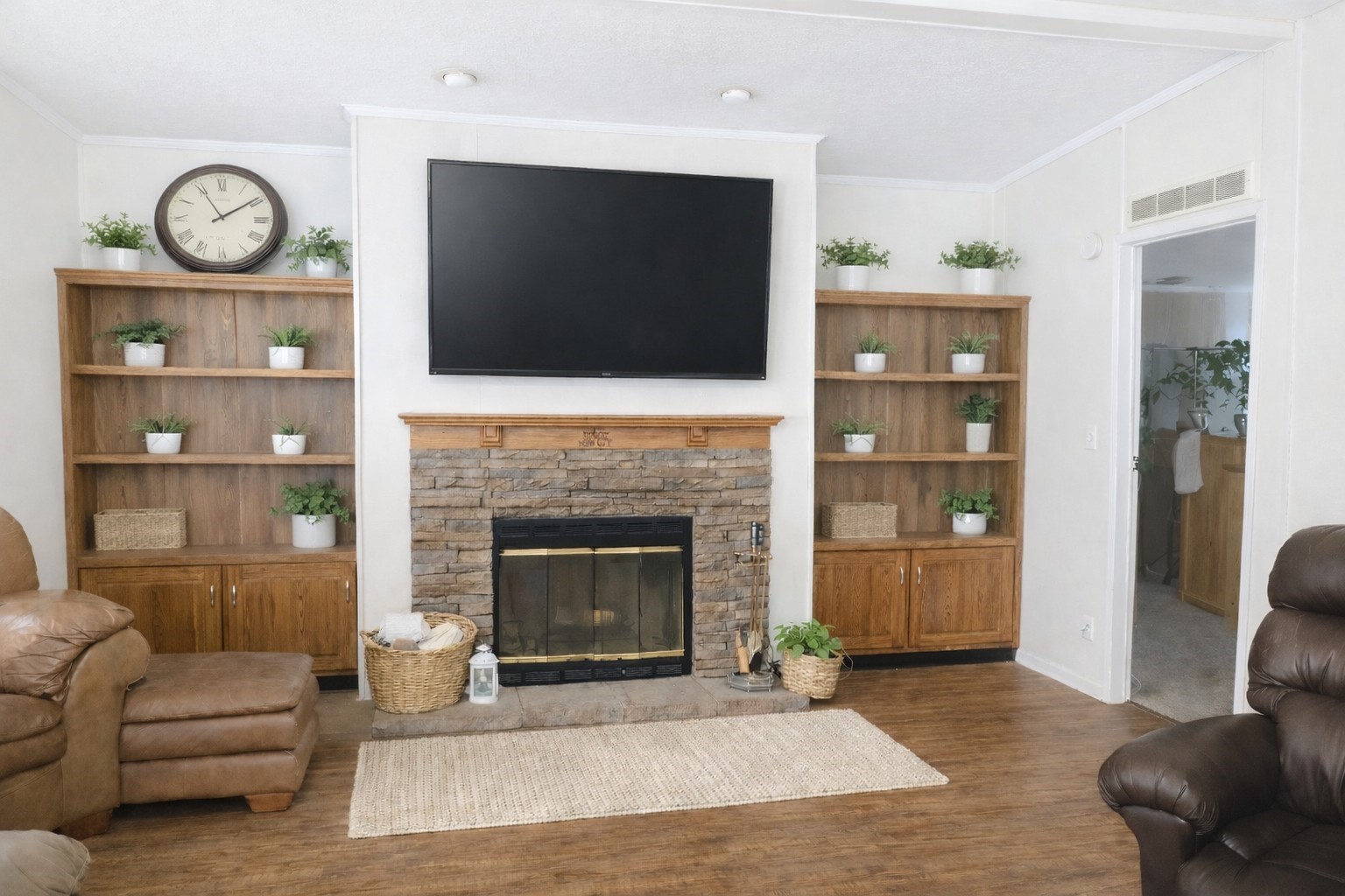 1202 County Road 1099 Wiergate, TX 75977 - Photo 13 of 22 a living room with furniture a flat screen tv and a fireplace