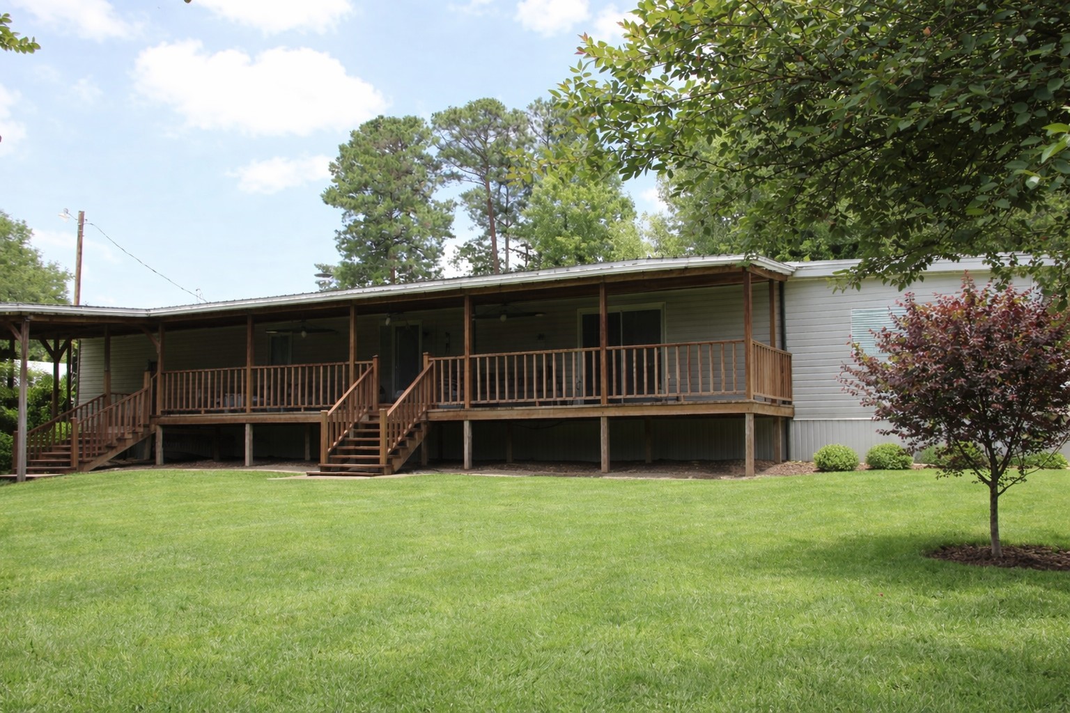 1202 County Road 1099 Wiergate, TX 75977 - Photo 6 of 22 a view of a house with yard and trampoline