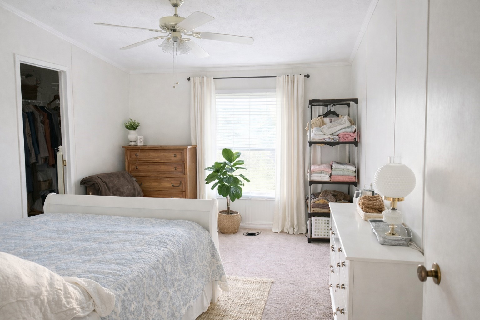 1202 County Road 1099 Wiergate, TX 75977 - Photo 10 of 22 a bedroom with a bed and potted plant on the dresser