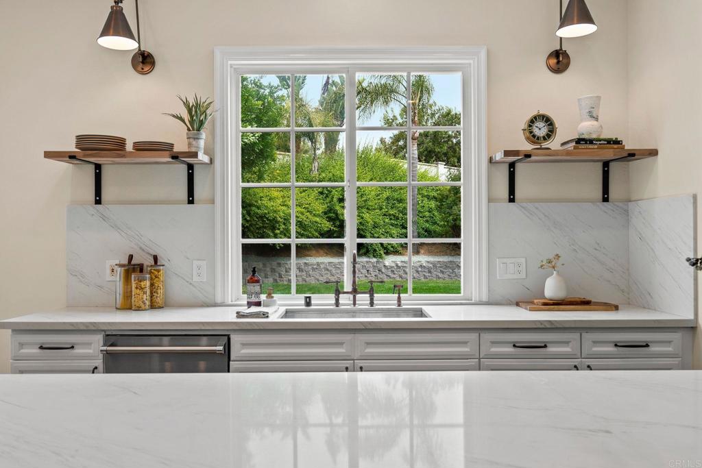 707 Olympus Street Encinitas, CA 92024 - Photo 13 of 47 a cabinet with a view of living room