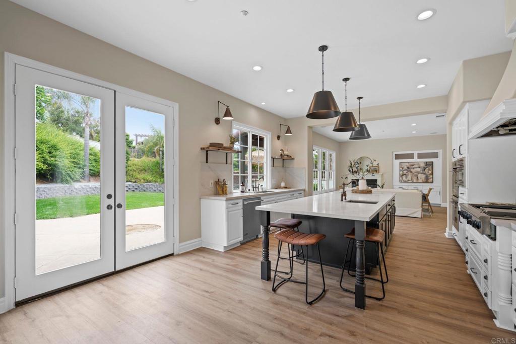 707 Olympus Street Encinitas, CA 92024 - Photo 14 of 47 a view of a dining room with furniture window and wooden floor
