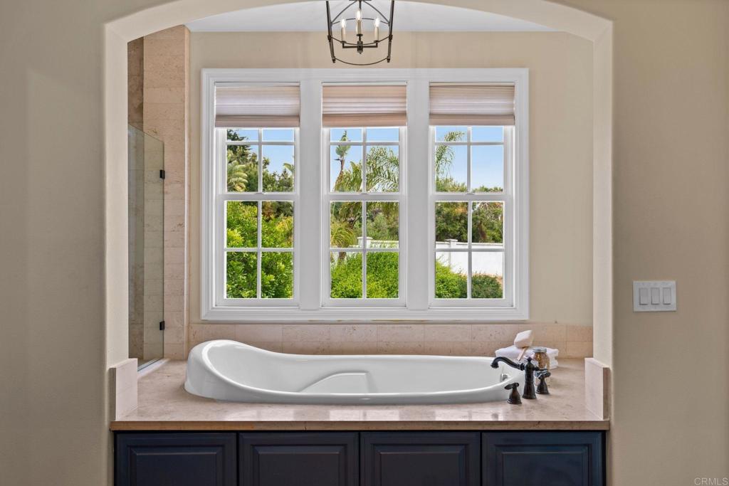 707 Olympus Street Encinitas, CA 92024 - Photo 2 of 47 a bathroom with a sink and a window