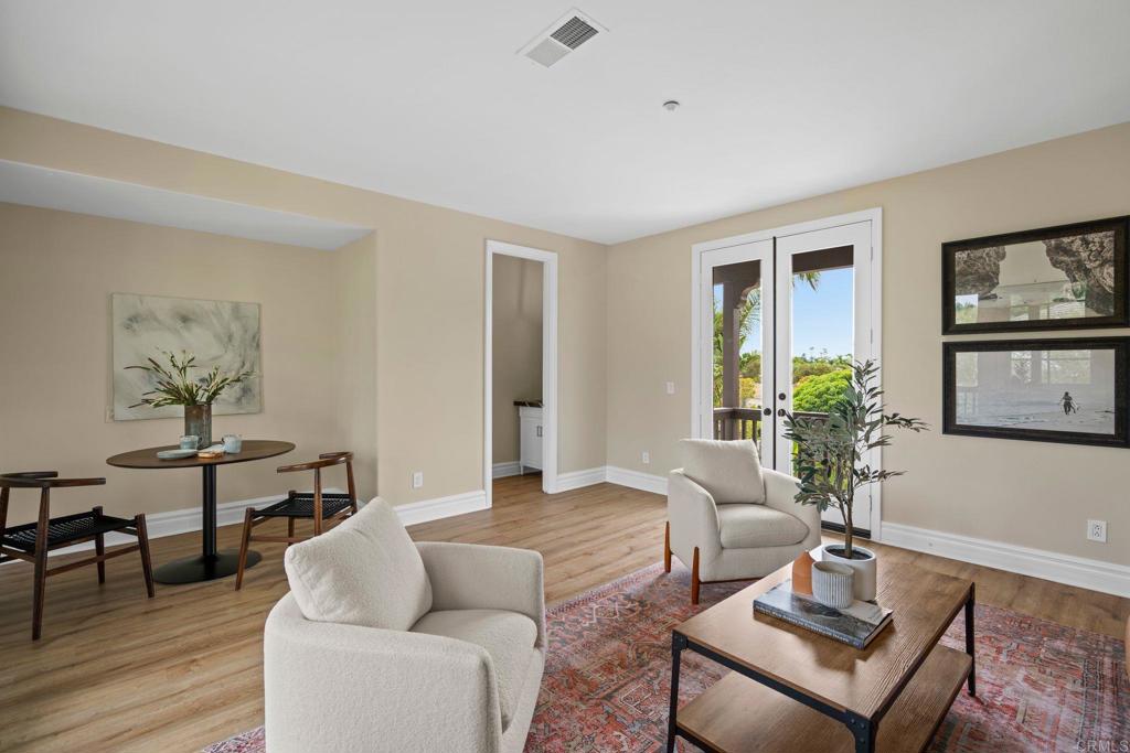 707 Olympus Street Encinitas, CA 92024 - Photo 40 of 47 a living room with furniture and wooden floor