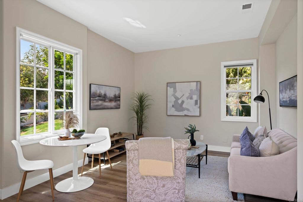 707 Olympus Street Encinitas, CA 92024 - Photo 43 of 47 a living room with furniture and a large window