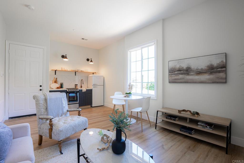 707 Olympus Street Encinitas, CA 92024 - Photo 44 of 47 a living room with furniture and wooden floor