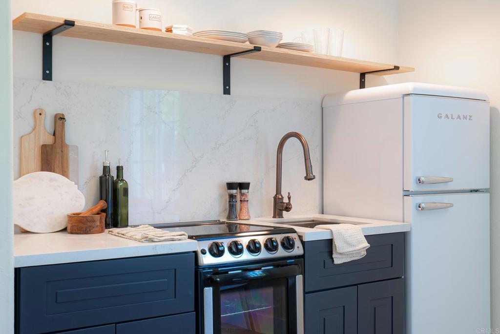 707 Olympus Street Encinitas, CA 92024 - Photo 45 of 47 a kitchen with a stove and a refrigerator