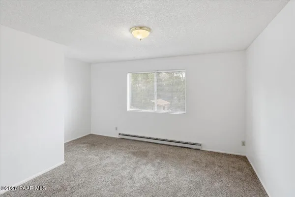 an empty room with a empty space and window