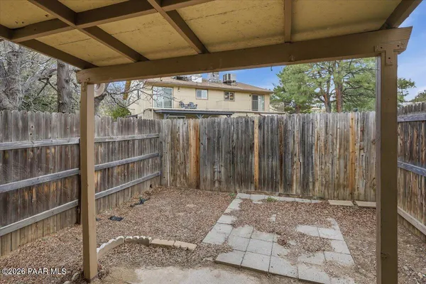 a view of outdoor space with wooden fence