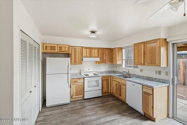 a kitchen with a sink stove and refrigerator