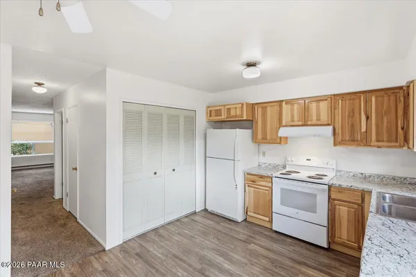 a kitchen with a stove top oven sink and cabinets