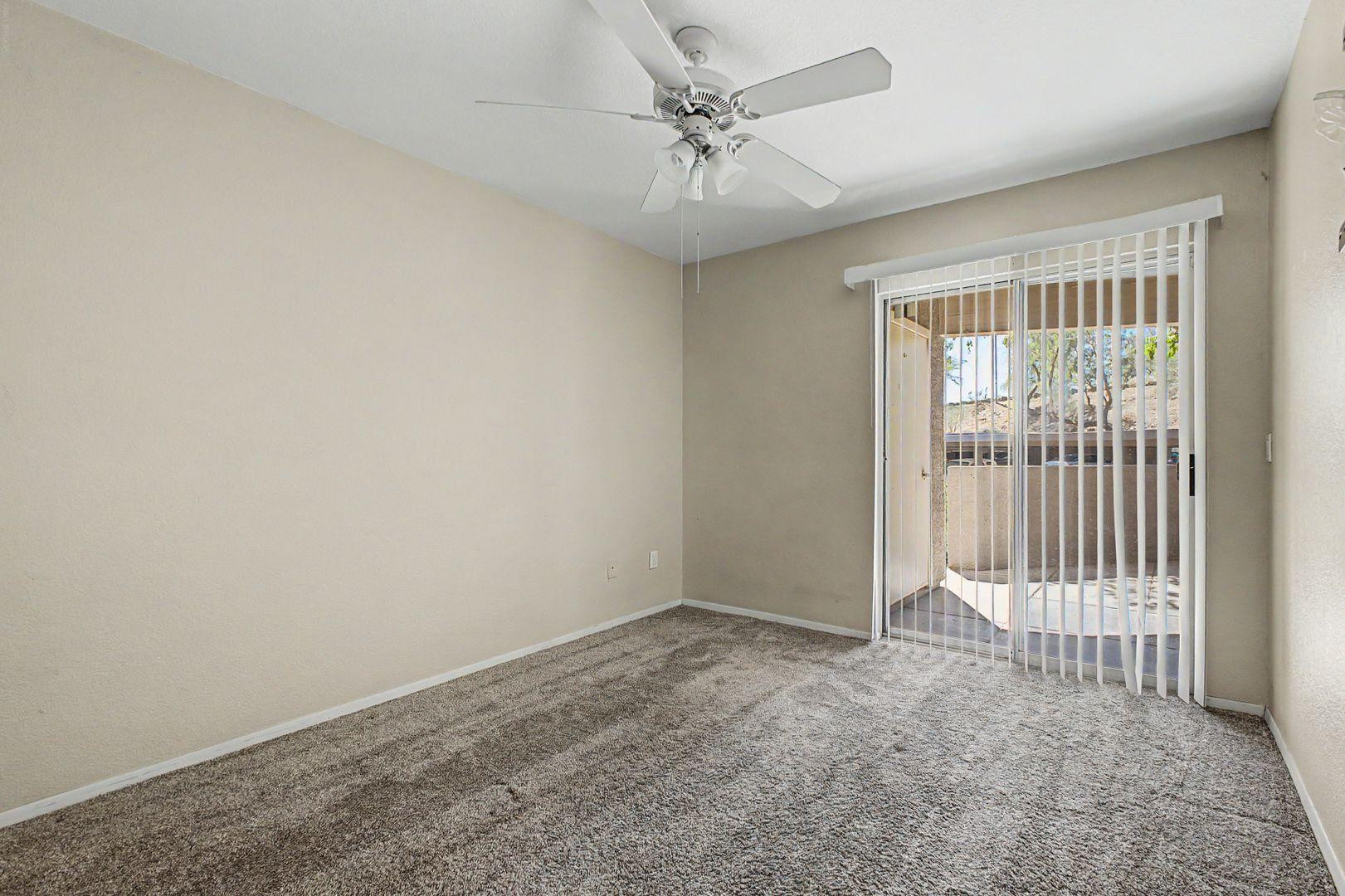 1720 East Thunderbird Road, Unit 1086 Phoenix, AZ 85022 - Photo 8 of 32 en empty room with windows