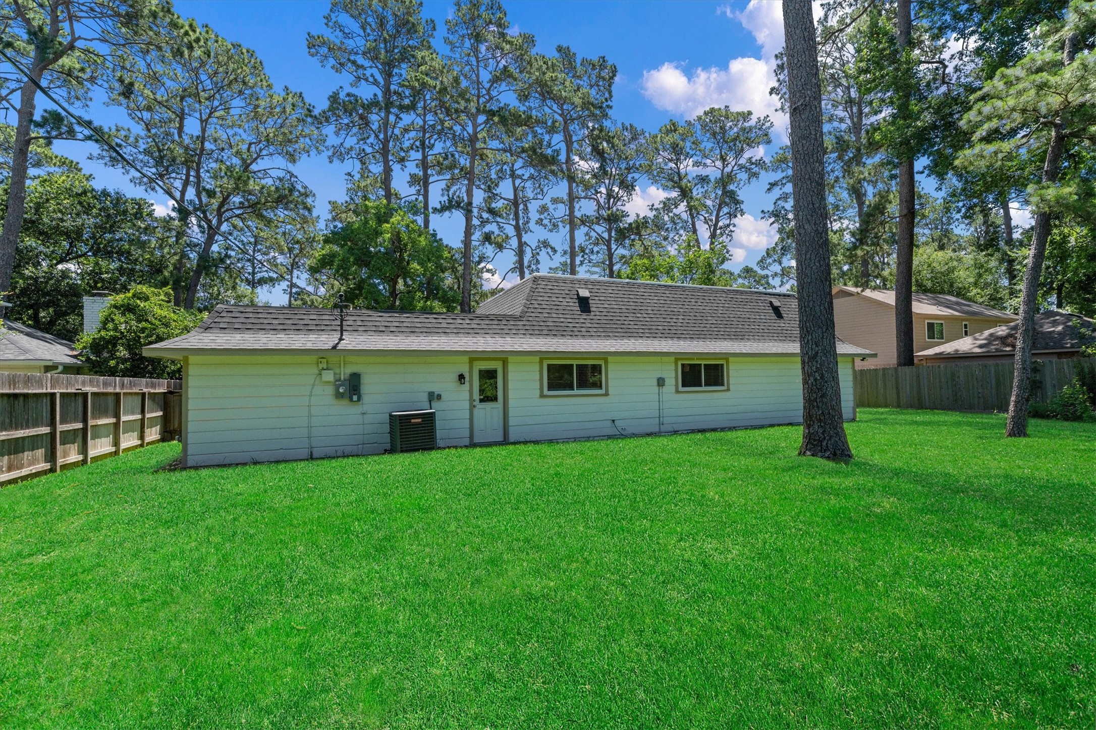 6530 Bayonne Drive Spring, TX 77389 - Photo 7 of 37 a view of a house with a yard and a tree