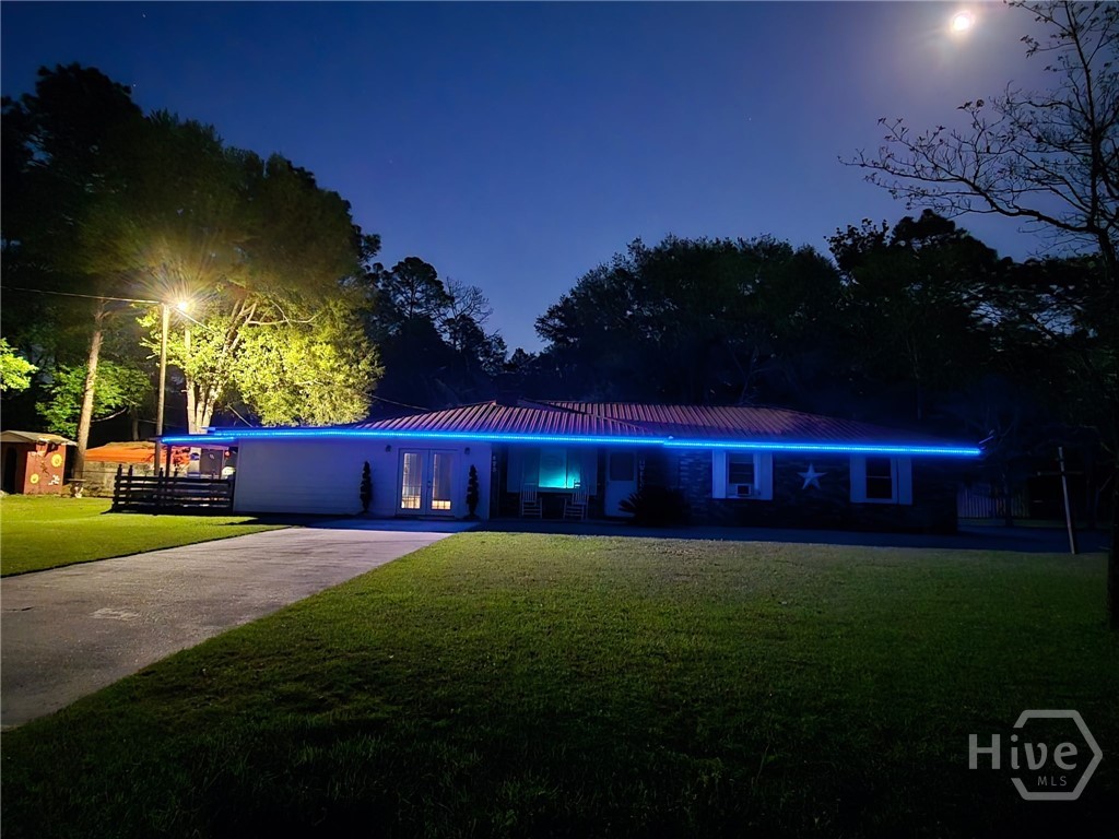 423 Place In The Country Road Hinesville, GA 31313 - Photo 51 of 60 LED Exterior lighting. Change color with the season