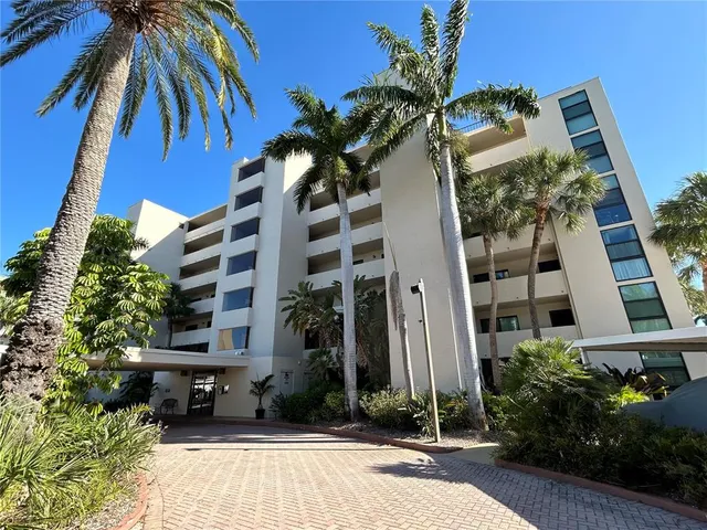 a view of a building with a yard