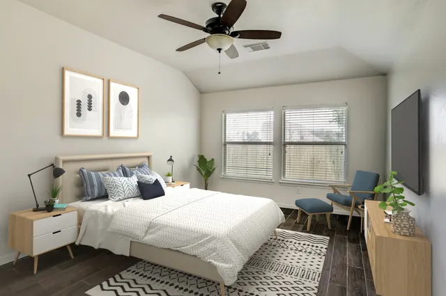 a bedroom with a bed and a couch