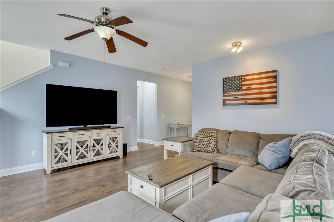 80 Smoke Rise Road Richmond Hill, GA 31324 - Photo 11 of 42 View of great room from kitchen. High ceilings an