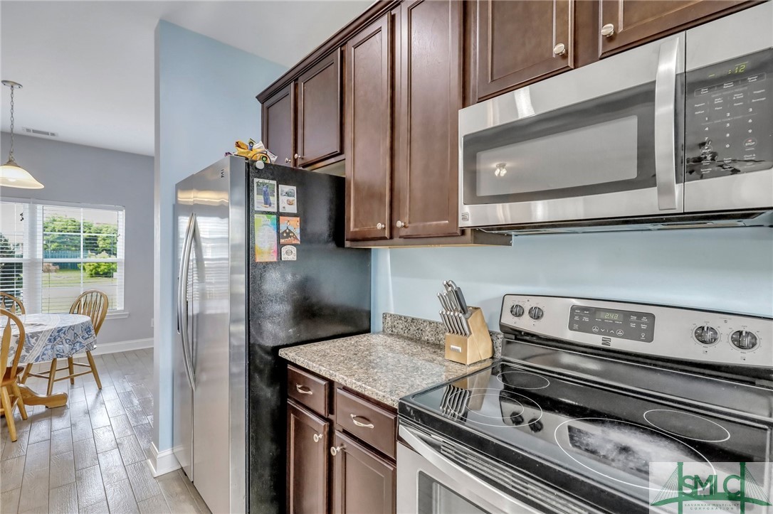 80 Smoke Rise Road Richmond Hill, GA 31324 - Photo 14 of 42 Stainless steel appliances and granite countertops